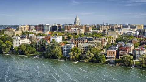 The capitol dome seen from lakeside apartment buildings in Madison, Wisconsin Aerial Stock Photos | DXP002_160_0003