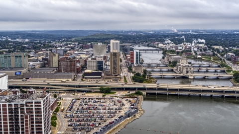 DXP002_164_0003 - Aerial stock photo of Wide view of apartment high-rise and office buildings near bridges and river, Downtown Cedar Rapids, Iowa