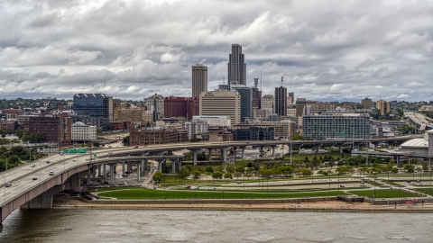 DXP002_168_0003 - Aerial stock photo of The city skyline and park across the river, Downtown Omaha, Nebraska