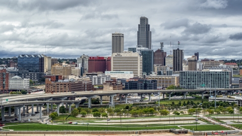 DXP002_169_0001 - Aerial stock photo of The city skyline seen from riverfront park, Downtown Omaha, Nebraska