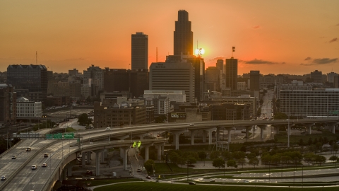 DXP002_172_0011 - Aerial stock photo of The skyline with the setting sun in background, Downtown Omaha, Nebraska