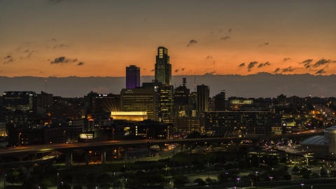 A view of skyscrapers in the skyline at twilight, Downtown Omaha, Nebraska Aerial Stock Photos | DXP002_173_0003