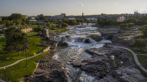 DXP002_176_0010 - Aerial stock photo of A view of Big Sioux River waterfalls at sunset in Sioux Falls, South Dakota