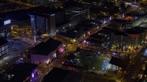 Bright lights and signs down Beale Street at nighttime, Downtown Memphis, Tennessee Aerial Stock Photos | DXP002_188_0001