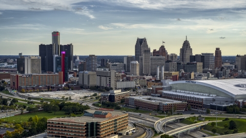 The skyline seen from near football stadium at sunset in Downtown Detroit, Michigan Aerial Stock Photos | DXP002_191_0006