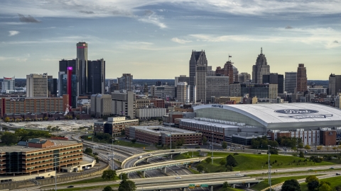 DXP002_191_0007 - Aerial stock photo of The football stadium and the city skyline at sunset in Downtown Detroit, Michigan