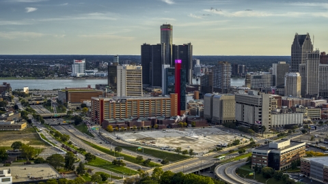 DXP002_191_0008 - Aerial stock photo of A view of tall skyscrapers and a hotel at sunset in Downtown Detroit, Michigan