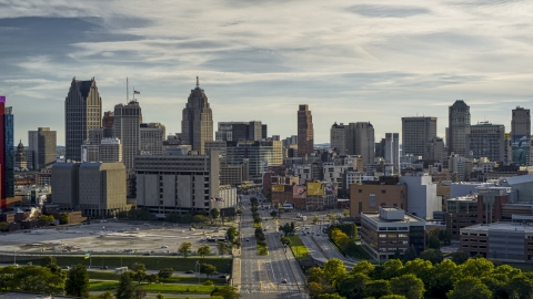 The city skyline seen from Gratiot Avenue at sunset in Downtown Detroit, Michigan Aerial Stock Photos | DXP002_192_0001