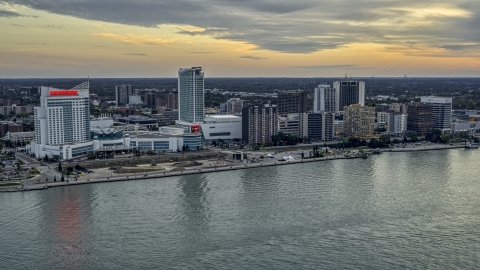 DXP002_192_0012 - Aerial stock photo of The city's skyline across the Detroit River, Windsor, Ontario, Canada, sunset