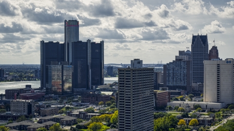 DXP002_194_0007 - Aerial stock photo of GM Renaissance Center overlooking the river behind apartment high-rise in Downtown Detroit, Michigan