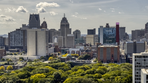 DXP002_194_0011 - Aerial stock photo of Churches between office tower and the hotel and casino, Downtown Detroit, Michigan