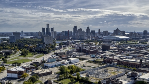 The city's skyline seen from brick industrial buildings, Downtown Detroit, Michigan Aerial Stock Photos | DXP002_195_0001