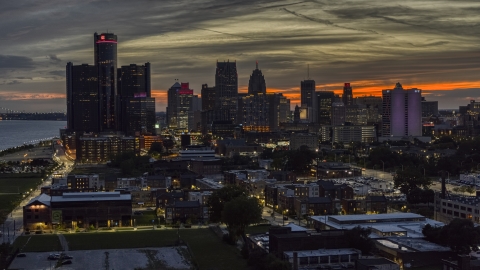 Tall skyscrapers at twilight in Downtown Detroit, Michigan Aerial Stock Photos | DXP002_198_0002