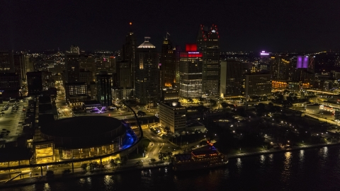 Towering skyscrapers and Hart Plaza at night, Downtown Detroit, Michigan Aerial Stock Photos | DXP002_199_0002