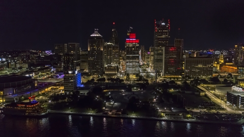 DXP002_199_0003 - Aerial stock photo of Hart Plaza and towering skyscrapers at night, Downtown Detroit, Michigan