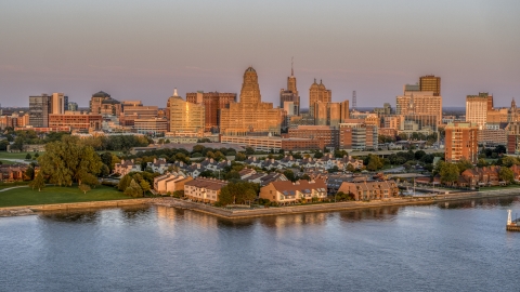 A view of city hall and office buildings at sunset, seen from waterfront condos, Downtown Buffalo, New York Aerial Stock Photos | DXP002_204_0013