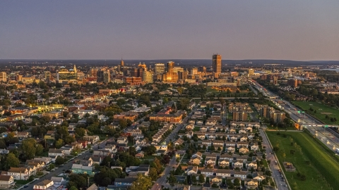 DXP002_204_0017 - Aerial stock photo of Seneca One Tower and the city's skyline seen from I-190 at twilight, Downtown Buffalo, New York