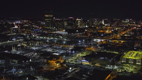 DXP002_205_0004 - Aerial stock photo of The skyline near arena parking lots at night, Downtown Buffalo, New York