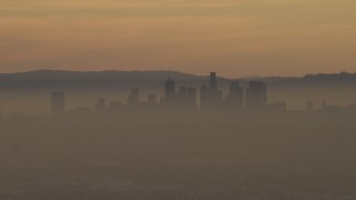 5K aerial stock footage of the Downtown Los Angeles skyline in haze at sunset, California Aerial Stock Footage | AF0001_000978