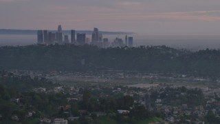 5K aerial stock footage of Downtown Los Angeles skyline seen from hillside homes at twilight, California Aerial Stock Footage | AF0001_001001