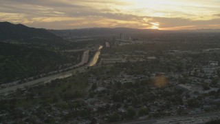 5K aerial stock footage of Los Angeles River, Highway 134, and neighborhoods at sunset, Burbank, California Aerial Stock Footage | AF0001_001008