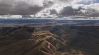 8K aerial stock footage of clouds over desert hills in Southern California Aerial Stock Footage | AF0001_001013