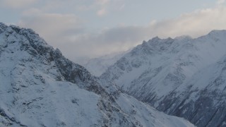 4K aerial stock footage snow-covered Chugach Mountains, clouds, Chugach National Forest, Alaska Aerial Stock Footage | AK0001_0003