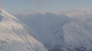 4K aerial stock footage flying by snow covered Chugach Mountain peaks, Chugach National Forest, Alaska Aerial Stock Footage | AK0001_0016