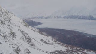 4K aerial stock footage pan right by Knik Glacier and Chugach Mountains, Knik Glacier, Alaska Aerial Stock Footage | AK0001_0023