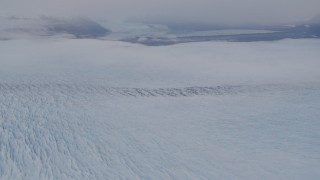 4K aerial stock footage tilting up to reveal Knik Glacier, distant mountains, Knik Glacier, Alaska Aerial Stock Footage | AK0001_0026