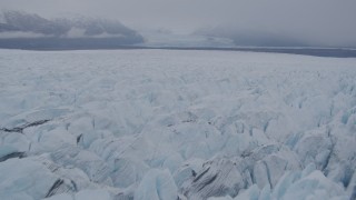 AK0001_0033 - 4K aerial stock footage flying low over surface of Knik Glacier, Alaska