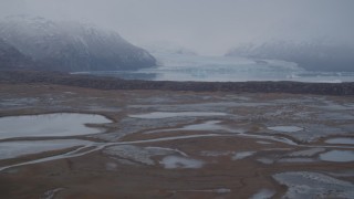 AK0001_0037 - 4K aerial stock footage flying low, approaching Inner Lake George and a glacier, Inner Lake George, Alaska