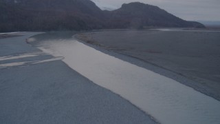 4K aerial stock footage flying over a winding river, revealing Chugach Mountains, Knik, Alaska Aerial Stock Footage | AK0001_0061