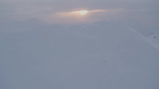 4K aerial stock footage snow covered peaks, reveal valley, Chugach Mountains, Alaska, sunset Aerial Stock Footage | AK0001_0080