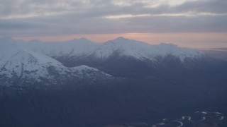 4K aerial stock footage flying over Eagle River, revealing Chugach Mountains, Eagle River, Alaska, sunset Aerial Stock Footage | AK0001_0085