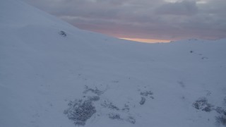 4K aerial stock footage approach snow covered summit, reveal sunset, Chugach Mountains, Alaska, sunset Aerial Stock Footage | AK0001_0090