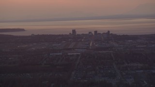 4K aerial stock footage approaching Merrill Field and Downtown Anchorage, Alaska, sunset Aerial Stock Footage | AK0001_0101