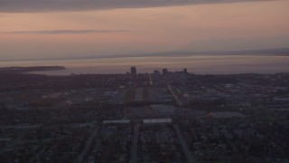 4K aerial stock footage approaching Merrill Field and Downtown Anchorage, Alaska, sunset Aerial Stock Footage | AK0001_0103