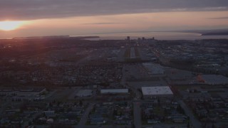 4K aerial stock footage approaching Merrill Field and Downtown Anchorage, Alaska, sunset Aerial Stock Footage | AK0001_0104