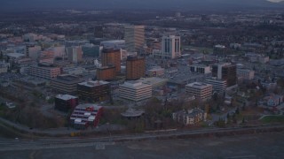 4K aerial stock footage orbiting hotels, revealing Downtown Anchorage, Alaska, twilight Aerial Stock Footage | AK0001_0107