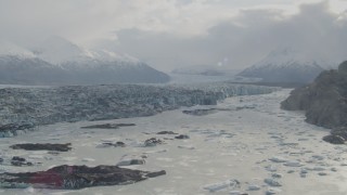 AK0001_0120 - 4K aerial stock footage descending towards Knik River, Chugach Mountains and Knik Glacier, Alaska