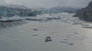 AK0001_0121 - 4K aerial stock footage flying low over icy Knik River, near Knik Glacier, Alaska