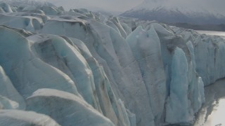 AK0001_0124 - 4K aerial stock footage flying over Knik River, approaching edge of Knik Glacier, Alaska