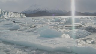 AK0001_0128 - 4K aerial stock footage flying low over Knik River, approaching the edge of the Knik Glacier, Alaska