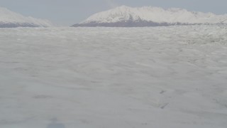 4K aerial stock footage flying low over Knik Glacier, approaching Chugach Mountains, Knik Glacier, Alaska Aerial Stock Footage | AK0001_0132