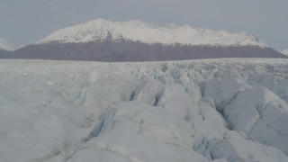 AK0001_0136 - 4K aerial stock footage fly close to surface of Knik Glacier, Chugach Mountains, Knik Glacier, Alaska