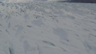 4K aerial stock footage fly over surface of Knik Glacier, approach Chugach Mountains, Knik Glacier, Alaska Aerial Stock Footage | AK0001_0139