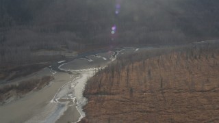 4K aerial stock footage flying by river along base of Chugach Mountains, Knik River Valley, Alaska Aerial Stock Footage | AK0001_0150