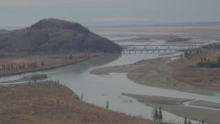 4K aerial stock footage following river, approaching Glenn Highway bridge, Knik River Valley, Alaska Aerial Stock Footage | AK0001_0151