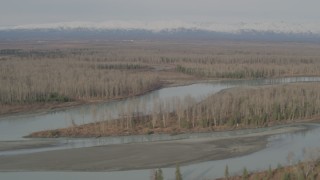 4K aerial stock footage flying along the river, Chugach Mountains in the distance, Knik River Valley, Alaska Aerial Stock Footage | AK0001_0152